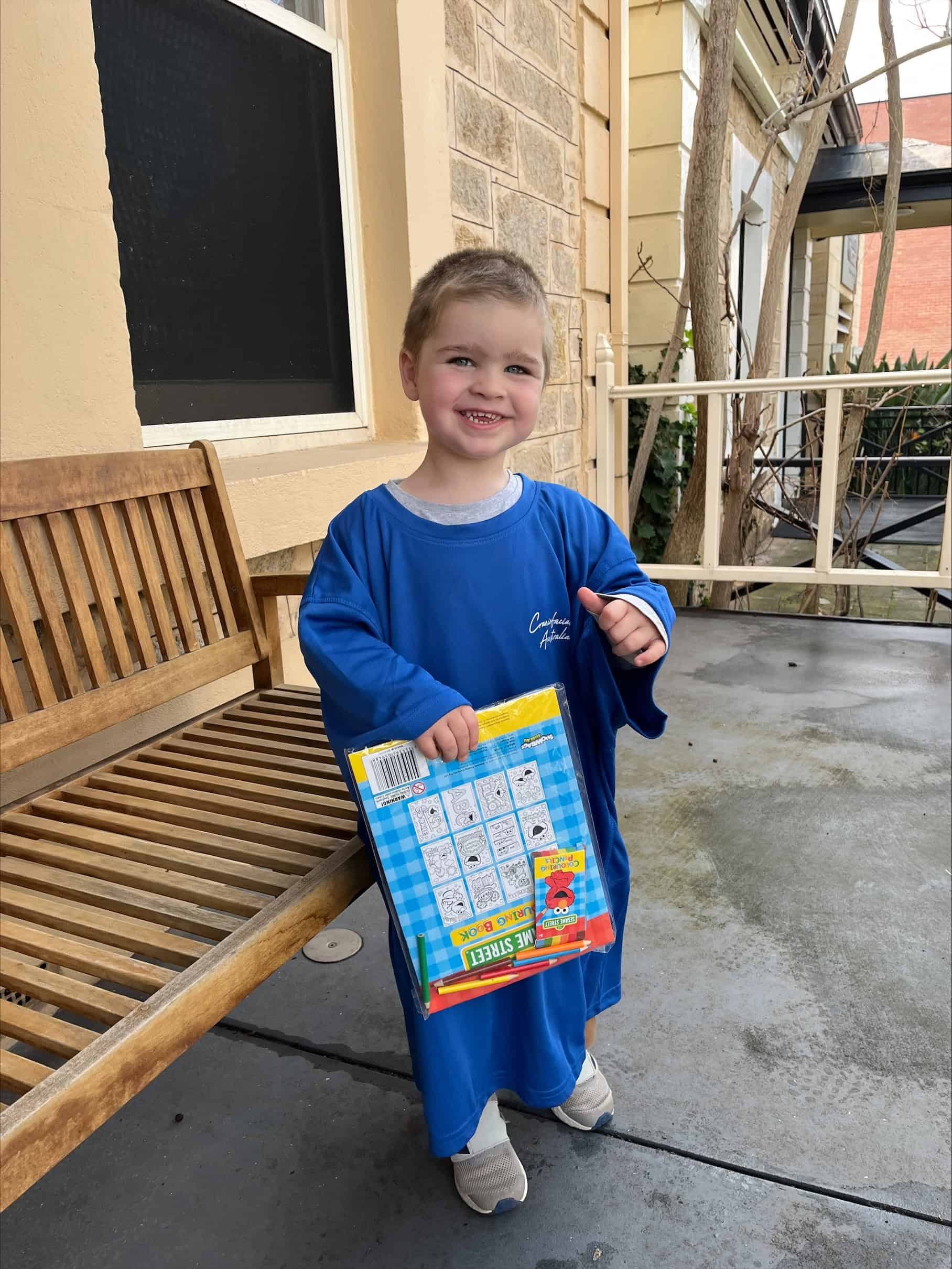 Little boy with sagittal synostosis outside Craniofacial Australia office