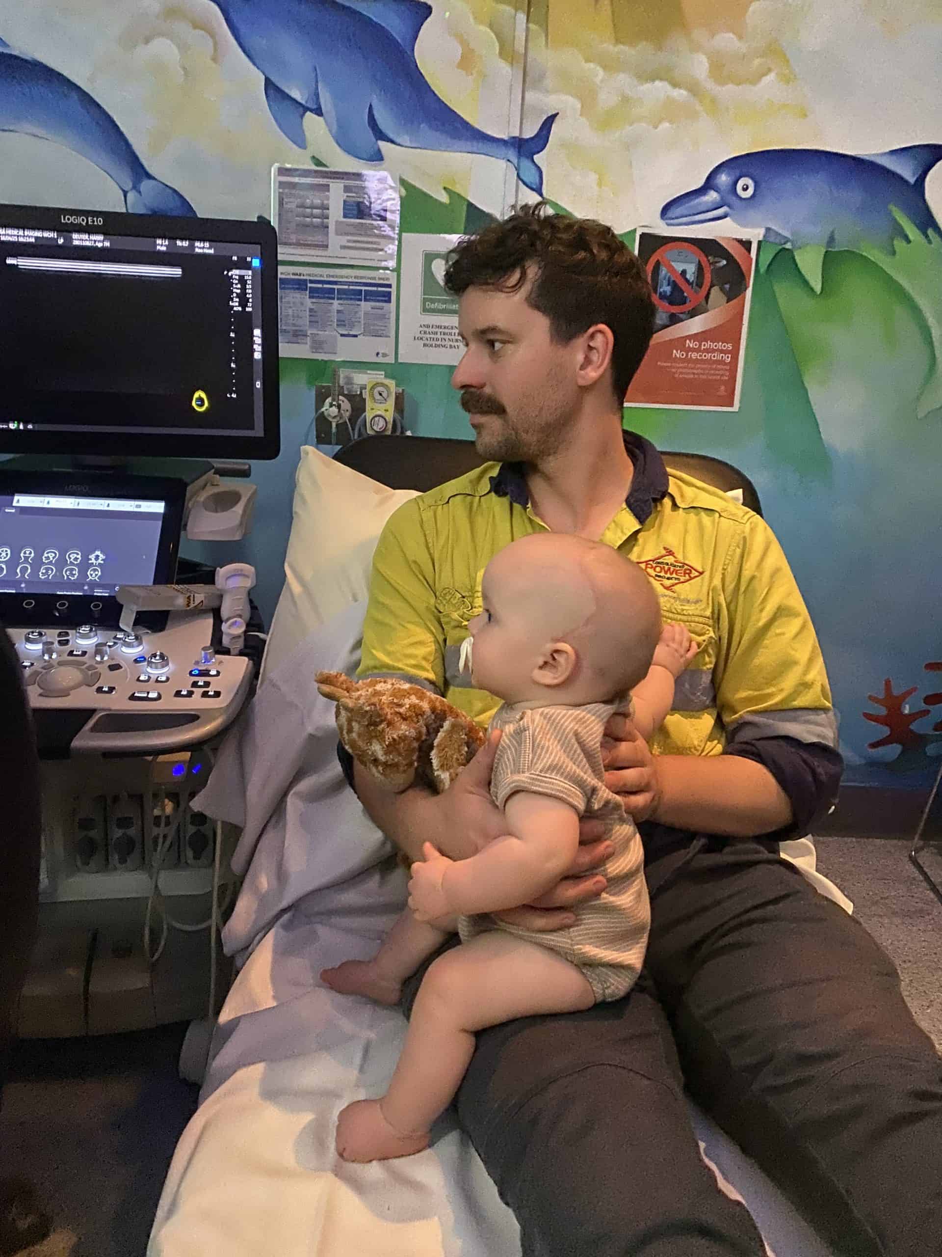 Child with craniofacial condition during medical consultation at Craniofacial Australia.